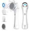 White facial cleansing brush with interchangeable heads on a white background
